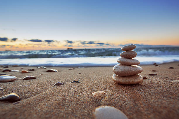 Stones balance Stones balance on beach, sunrise shot tranquil scene photos stock pictures, royalty-free photos & images