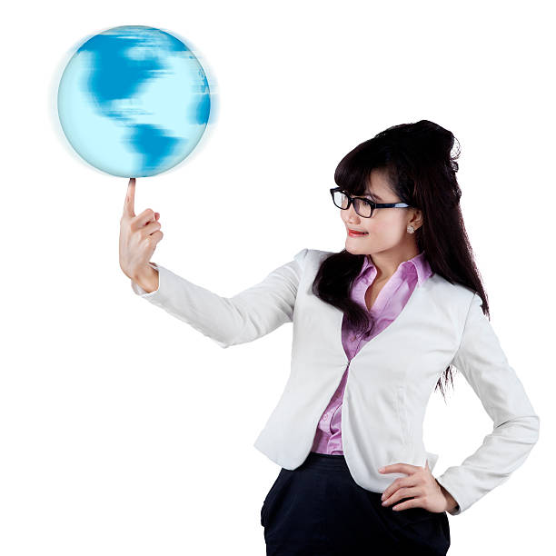 Businesswoman with globe on finger Businesswoman is holding world globe with one finger, isolated on white background. finger spinning globe stock pictures, royalty-free photos & images