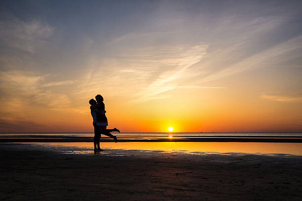 istock Romantic Couple kissing at Sunset 491243401