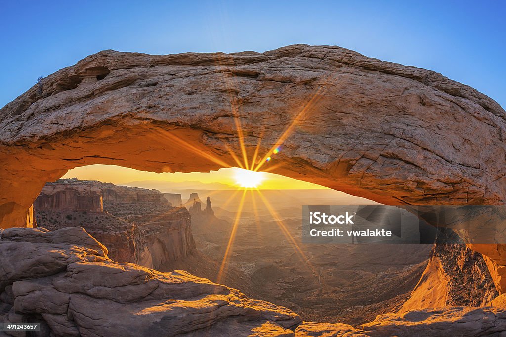 Famous sunrise at Mesa Arch Famous sunrise at Mesa Arch in Canyonlands National Park near Moab, Utah, USA Canyon Stock Photo