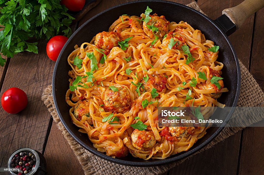 Pasta linguine with meatballs in tomato sauce. Pasta linguine with meatballs in tomato sauce. Top view 2015 Stock Photo