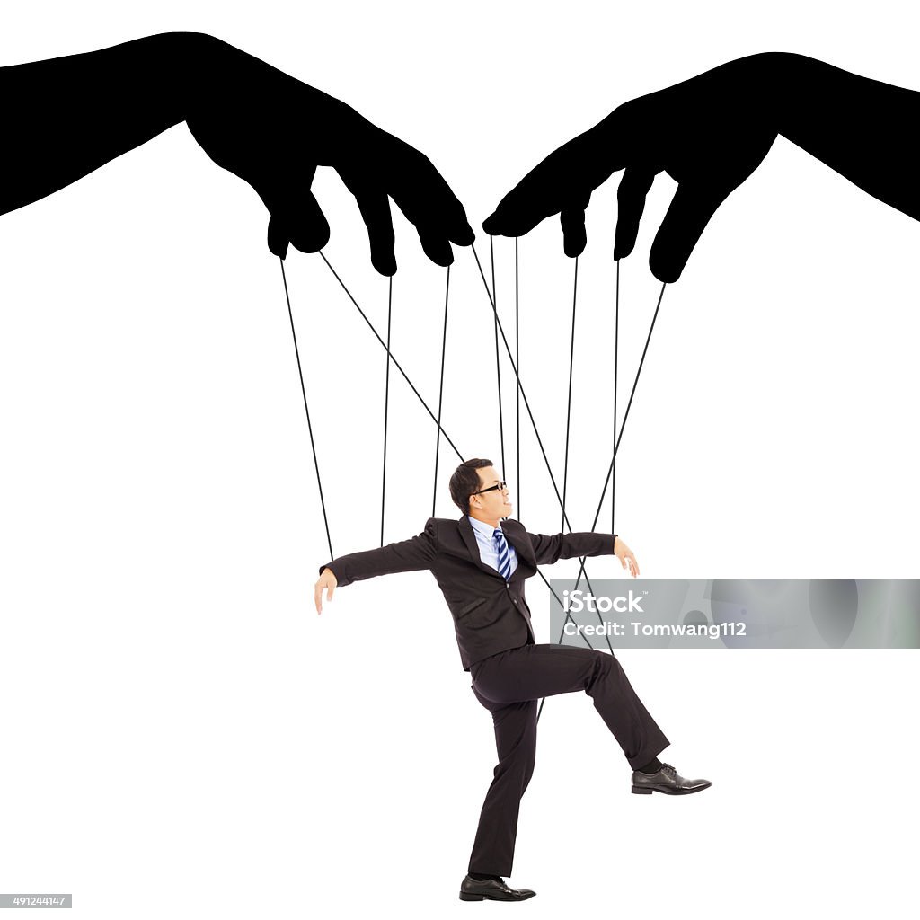 black hands shadow control a businessman action black hands shadow control a businessman action with white background Puppet Stock Photo