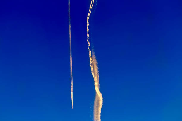 istock long trail of jet plane on blue sky 491244365