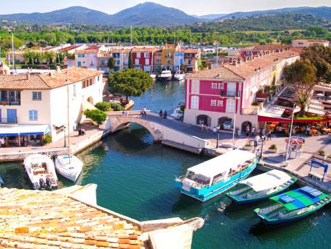 Yacht Harbor in Port Grimaud, South of France. Port Grimaud is part of the village Grimaud, near Saint-Tropez. Port Grimaud is a seaside town on the bay of Saint Tropez. It was built with channels in a Venetian manner, but the houses are in Provence style.