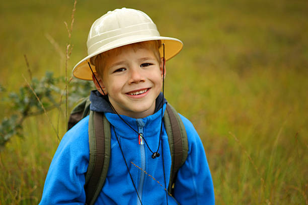 istock Smiling Explorer Boy in Safari Hat Outdoors 491245112