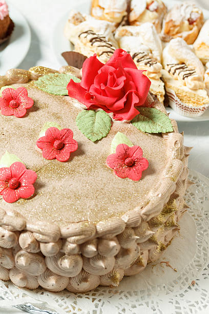 Cream cake with sugar red flowers stock photo