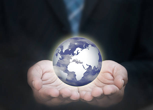 istock Business man holding the world 491245406