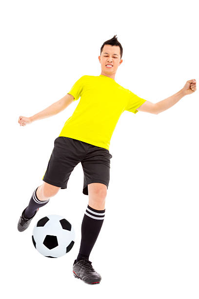 istock Soccer player kicking ball 491246637