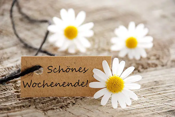 A Natural Looking Label with the German Words Schoenes Wochenende which means Happy Weekend