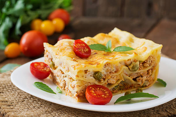 istock Lasagna with minced meat, green peas and sauce 491247402