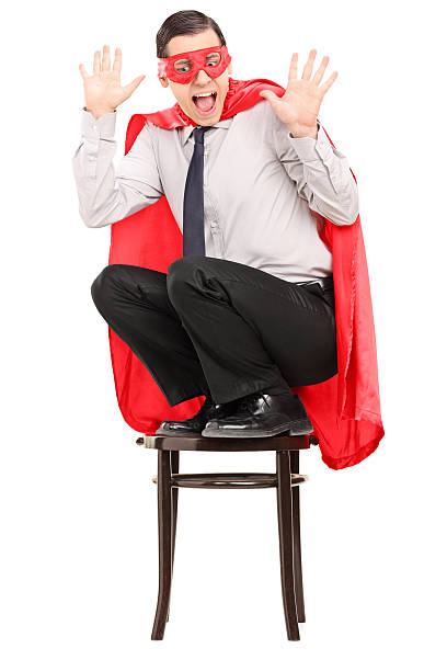 istock Terrified superhero standing on a chair 491247645