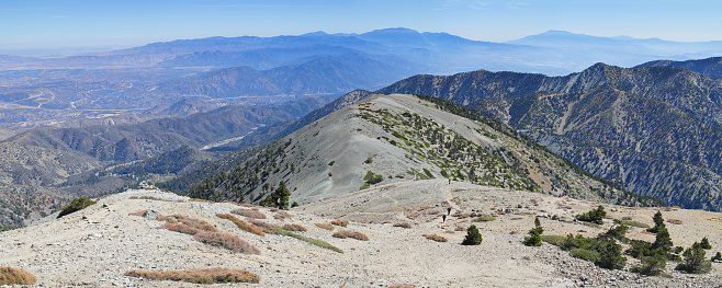 Hikers on the trail leading to the summit of Mount Baldy - the highest peak of the San Gabriel Mountains in Los Angeles County (10068ft). Mount Baldy - visible on clear days - dominates the view of the Los Angeles skyline. It is accessible via hiking trails on a number of connecting ridges.