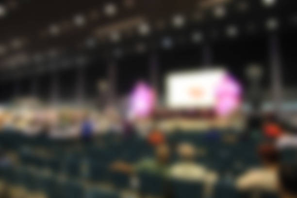istock trade show area and people. Blurred image background. 491249104