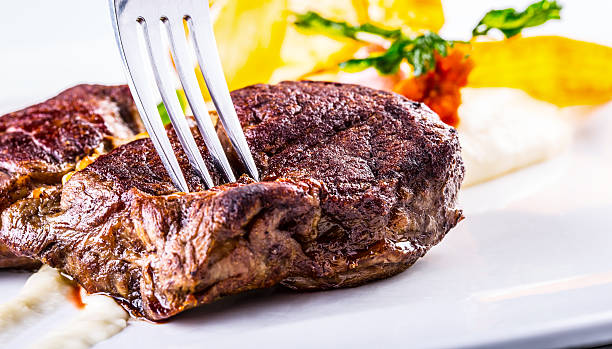 istock Close up Tender Grilled Beef Meat on White Plate 491260864