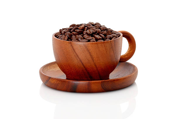 coffee beans in wooden cup isolated stock photo
