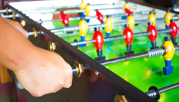 istock hand hold and play a tabletop soccer 491266924