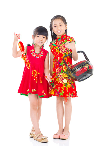 Asian Chinese girls decorating for Chinese new year