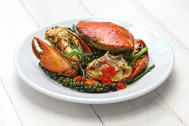 kampot green pepper crab stir-fried crab with green kampot pepper, cambodian cuisine kep stock pictures, royalty-free photos & images