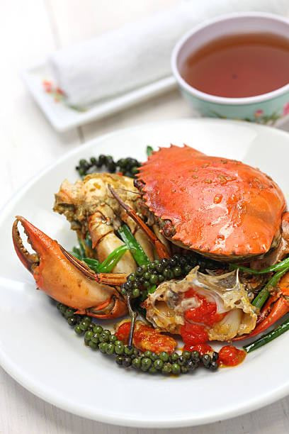 kampot green pepper crab stir-fried crab with green kampot pepper, cambodian cuisine kep stock pictures, royalty-free photos & images