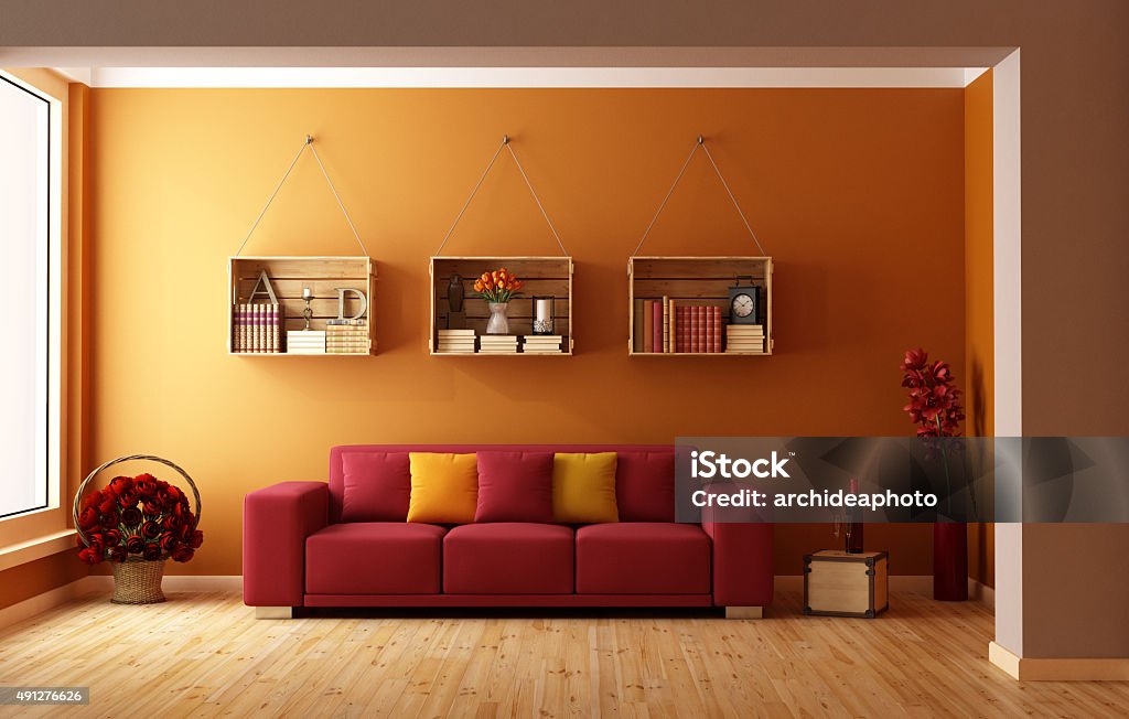 Orange lounge Living room with red sofa and wooden crates used as a bookcase  - 3D Rendering Orange Color Stock Photo
