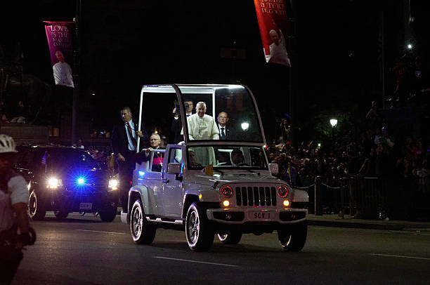 Philadelphia, PA, USA - September 26, 2015; Pope Francis I. rides in the back of a to Popemobile converted white Jeep, during his parade in Center City Philadelphia, Pennsylvania. The event is part of the historic visit of the Pope to the United States.  (photo by Bastiaan Slabbers) 