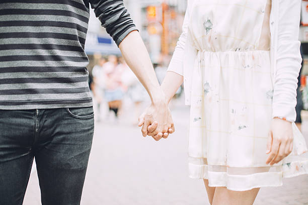 istock Young couple against cityscape background 491277944