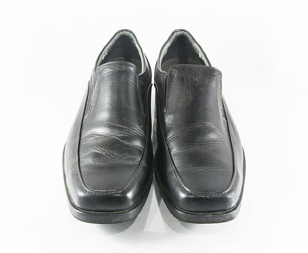 istock Black man leather shoes on white background. 491281120