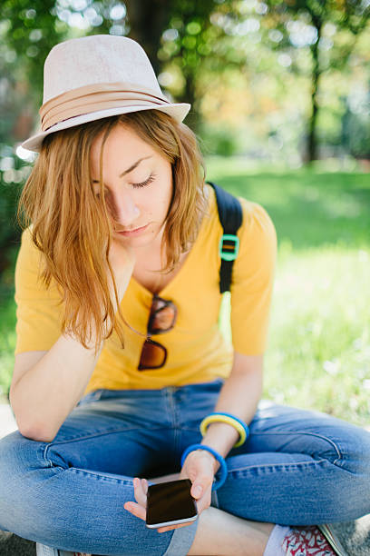 Teenage girl feeling depressed in the park