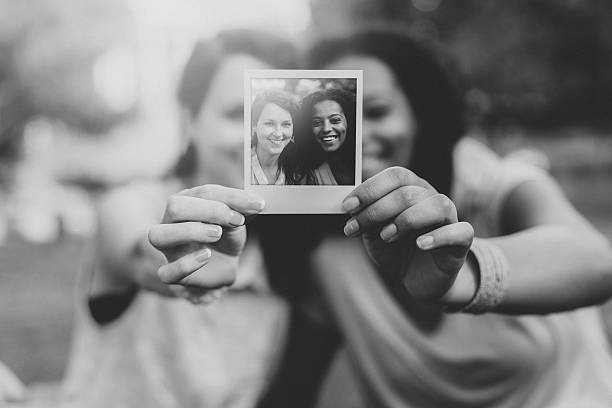 istock Best friends together holding instant selfie 491282930