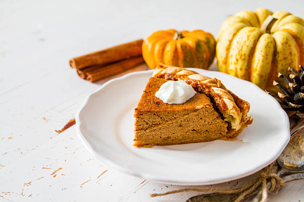 istock Pumpkin pie, white wood background 491291524