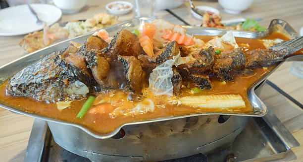 istock Sour soup made of tamarind paste with fish 491291612