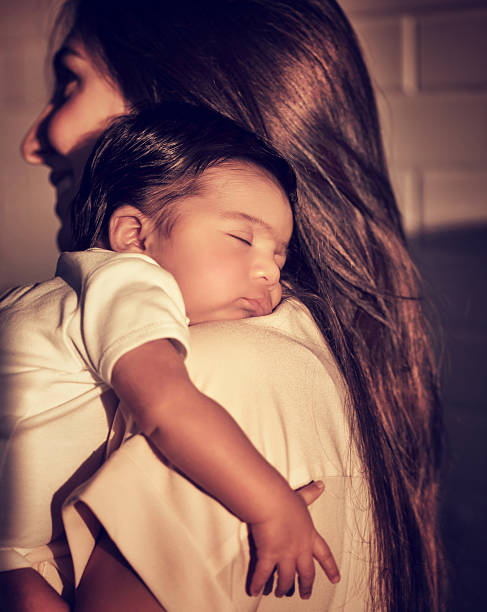 istock Mother with sleeping baby 491295468