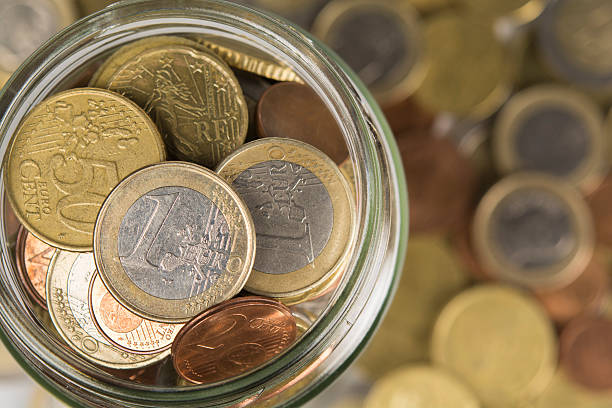 istock Cash Jar Filled with coins 491297060