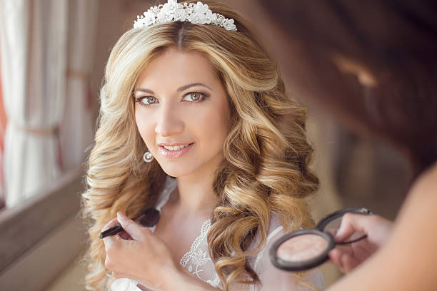 istock make up stylist. Healthy hair. beautiful smiling bride wedding 491297376