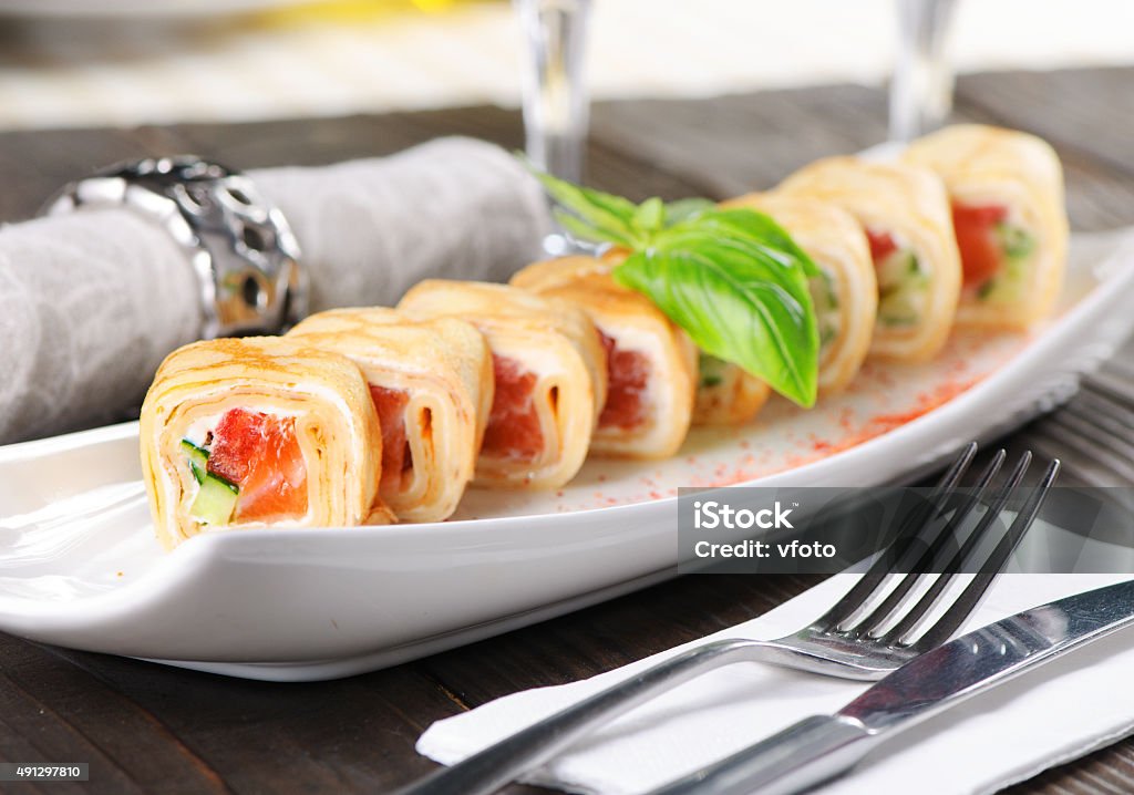 Pancake roll with salmon Pancake roll with salmon. Close-up shot 2015 Stock Photo