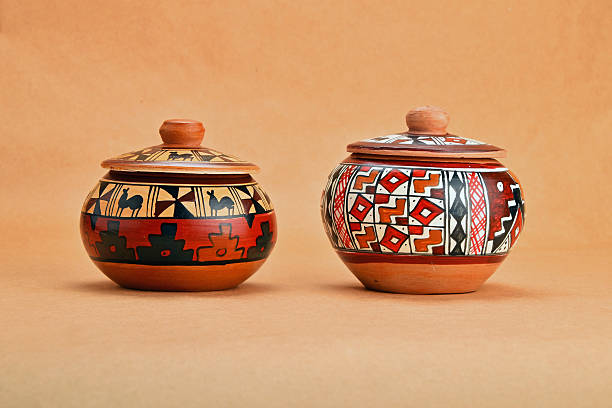 istock Two painted handmade ceramic pot with lids on kraft paper 491298110