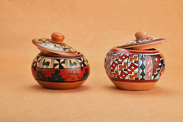 istock Two painted handmade ceramic pot with lids on kraft paper 491298276