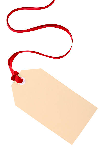 Plain gift tag with red ribbon isolated on white background stock photo