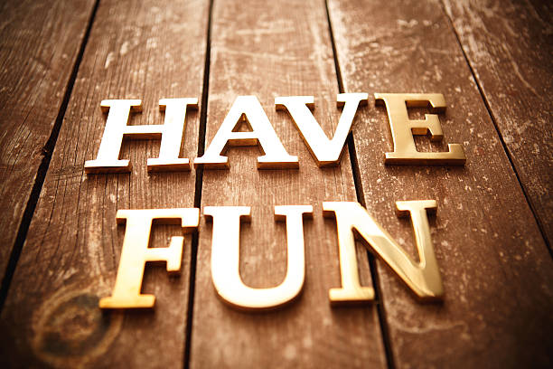 istock Have fun gold metal text on wood 491315688