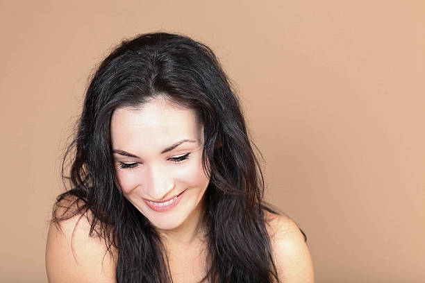 istock Woman Looking Down and Smiling 491316204