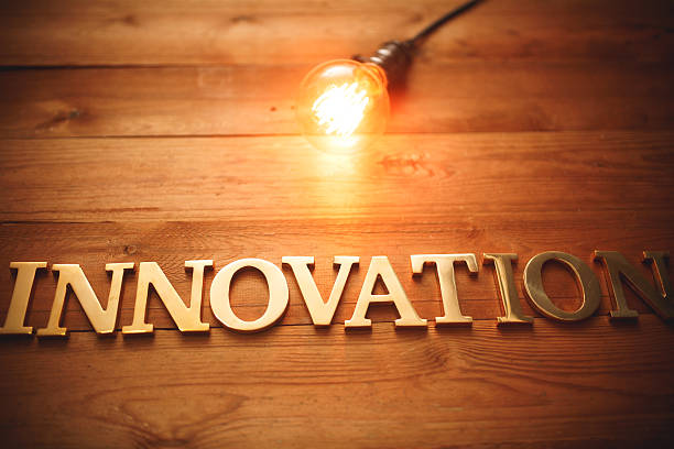 istock Golden innovation text on wood with light bulb 491316350