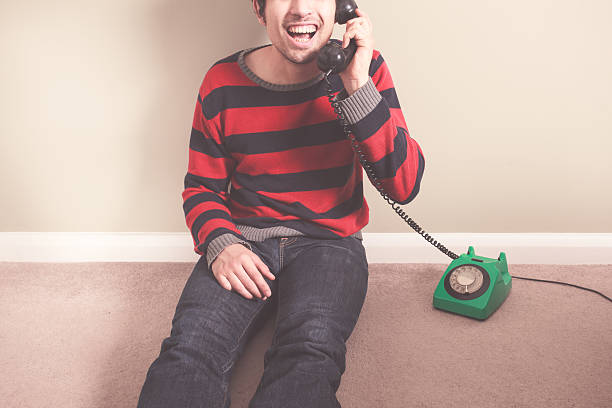istock Happy young man on the telephone 491322377