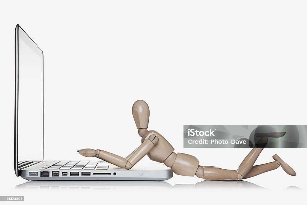 Social Networking Manikin next to a laptop computer Business Stock Photo