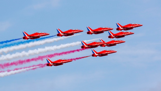 Silverstone, England - June 30, 2013: RAF aerobatics display team the Red Arrows give a display prior to the 2013 British Grand Prix.