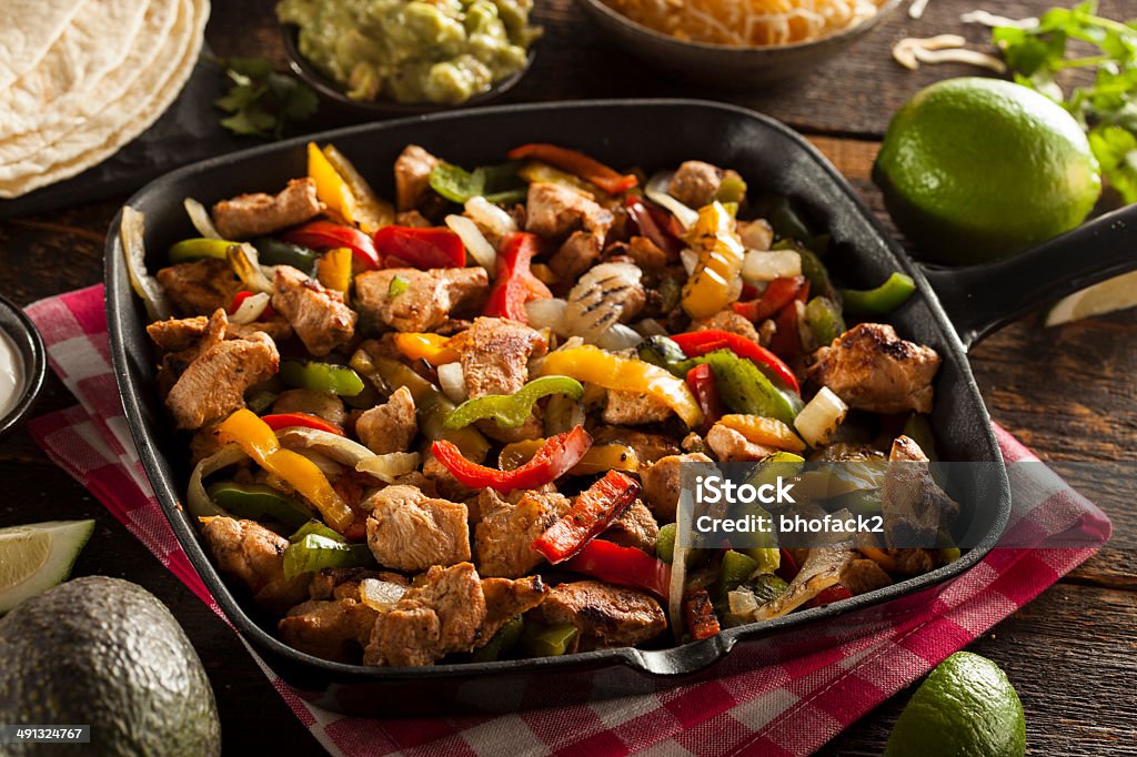 Homemade Chicken Fajitas with Vegetables Homemade Chicken Fajitas with Vegetables and Tortillas Avocado Stock Photo