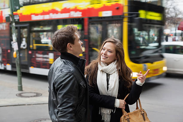 istock Young Couple In Jackets Communicating On Street Side 491326189