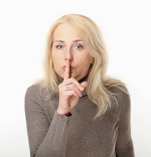 istock Young Woman Quiet Sign Hush Hand Gesture. 491326763