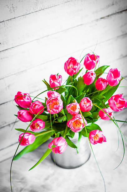 istock Tulips on wooden rustic background 491327923