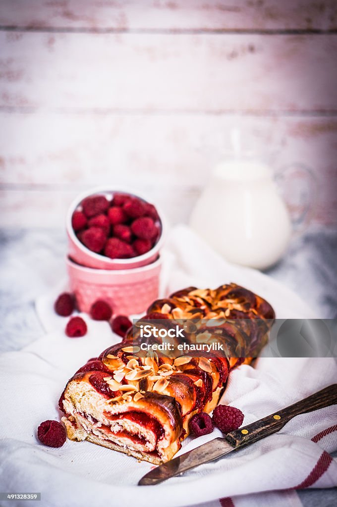 Raspberry cake with almonds on wooden background Backgrounds Stock Photo