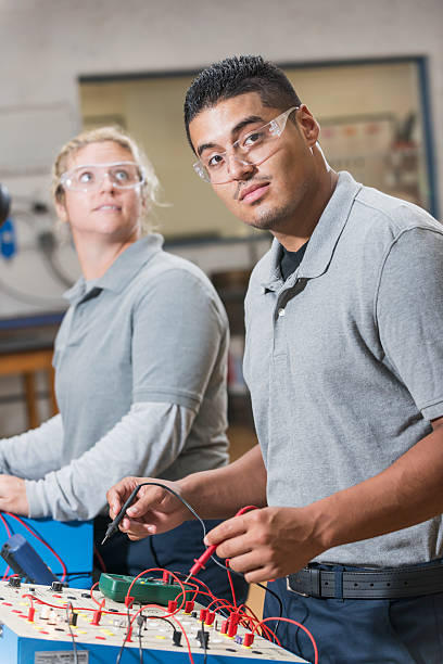 istock Adult students in vocational class using circuit boards 491331846